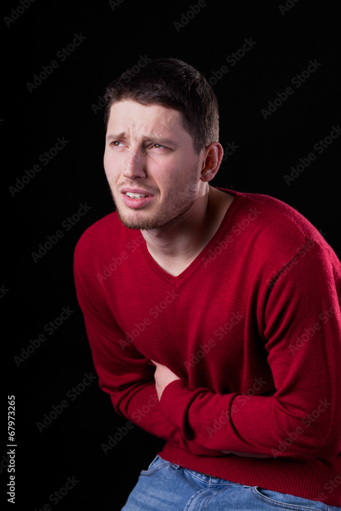 Young man with stomach ache