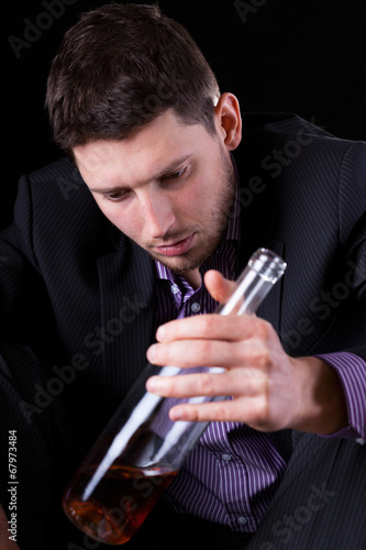 Elegant man drinking alcohol