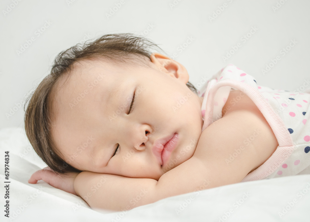Asian baby girl sleeping on bed Asian baby girl sleeping on bed