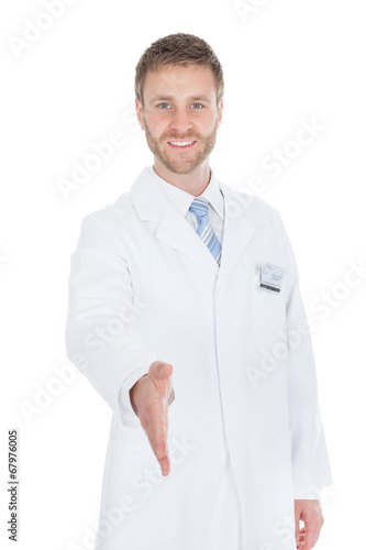 Smiling Male Doctor Offering Handshake © Andrey Popov