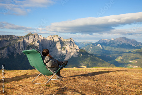Man sitting in lounge chair