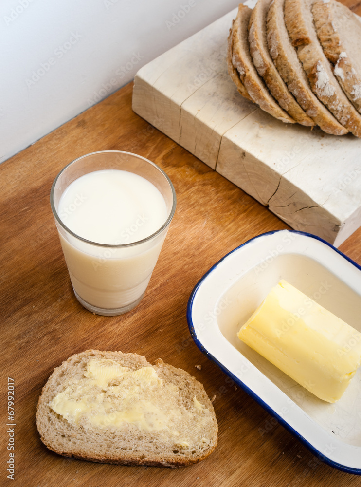 buttered bread with glass of milk buttered bread with glass of milk