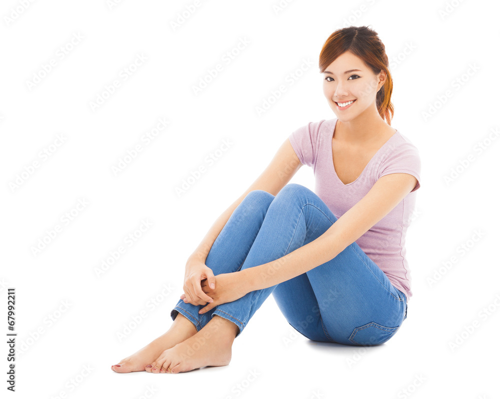 happy and beautiful young student sitting on the floor happy and beautiful young student sitting on the floor
