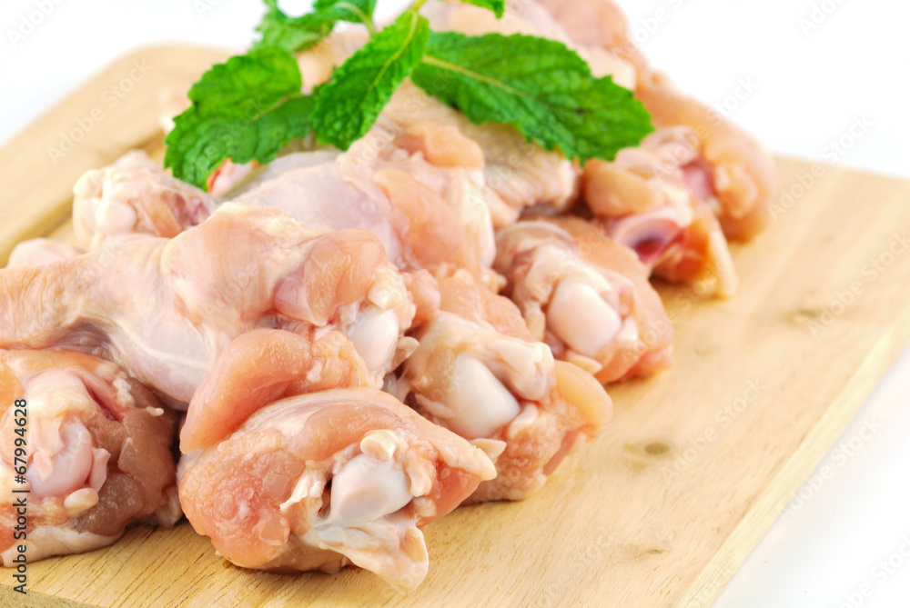 Chicken wing meat on chop board