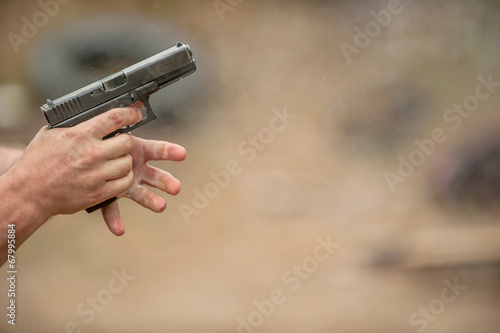 Changing Pistol Clip. Outdoor Shooting Range