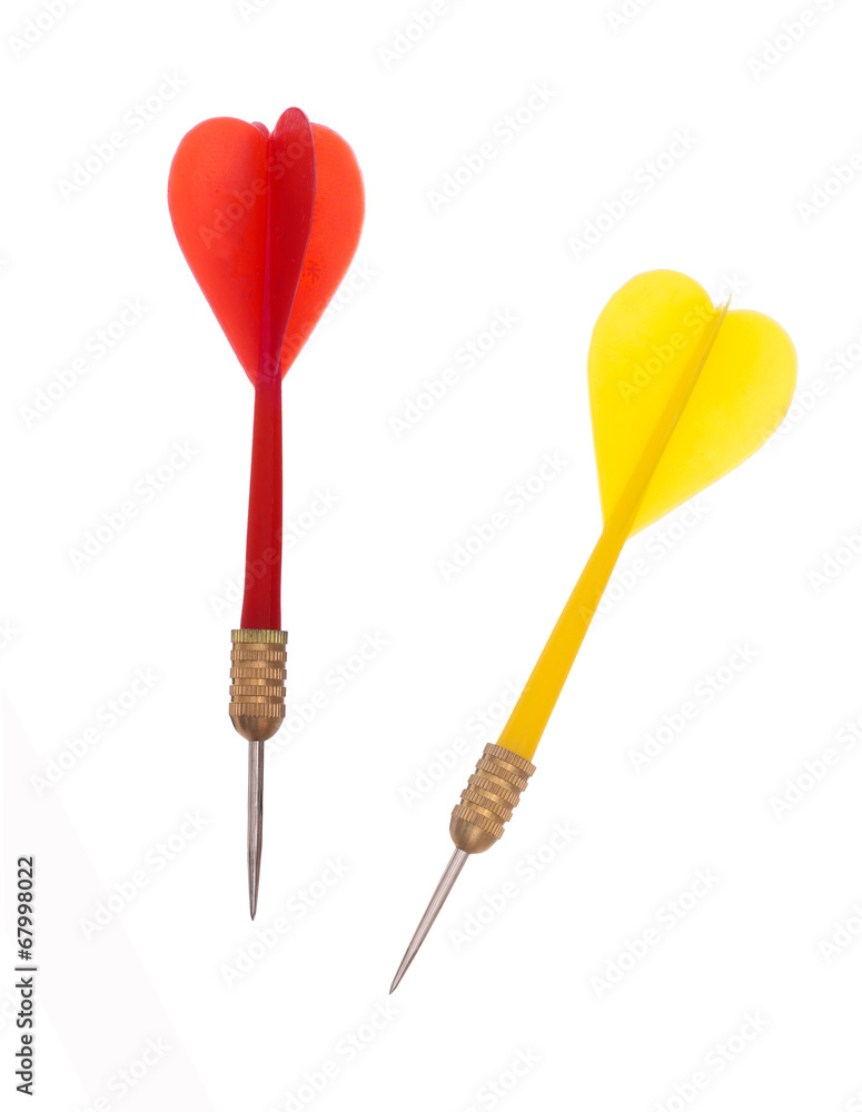 Red and yellow plastic darts on white background - target Red and yellow plastic darts on white background - target