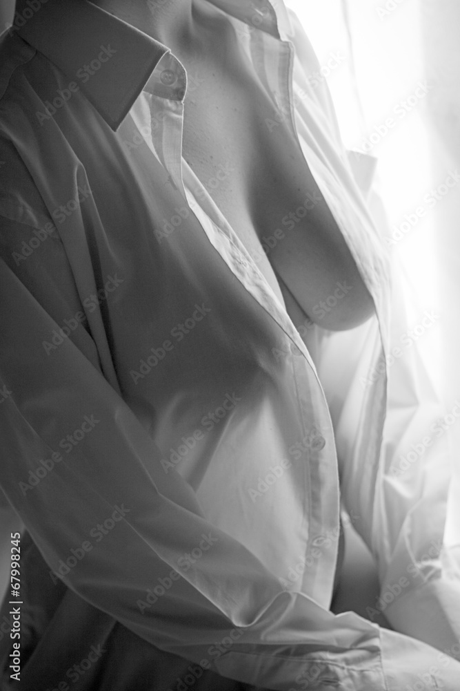 Breasts showing through a white shirt Stock Photo