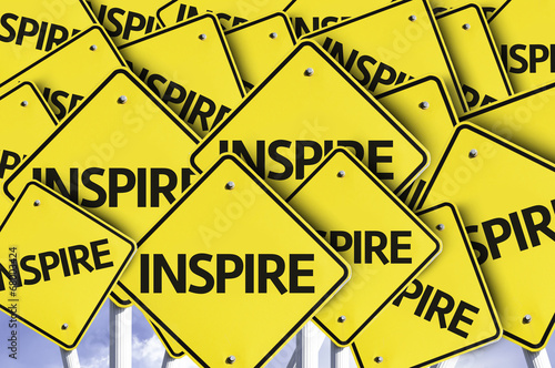 Inspire written on multiple road sign