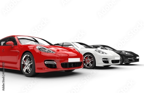 Three modern fast cars in a row  side angle view
