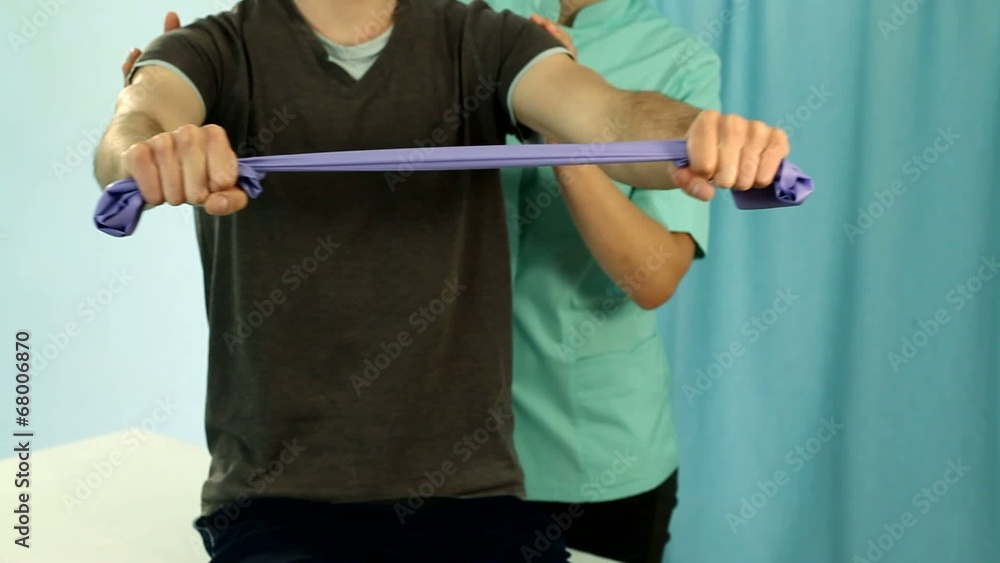 Man making stretching on physiotherapy video Man making stretching on physiotherapy video