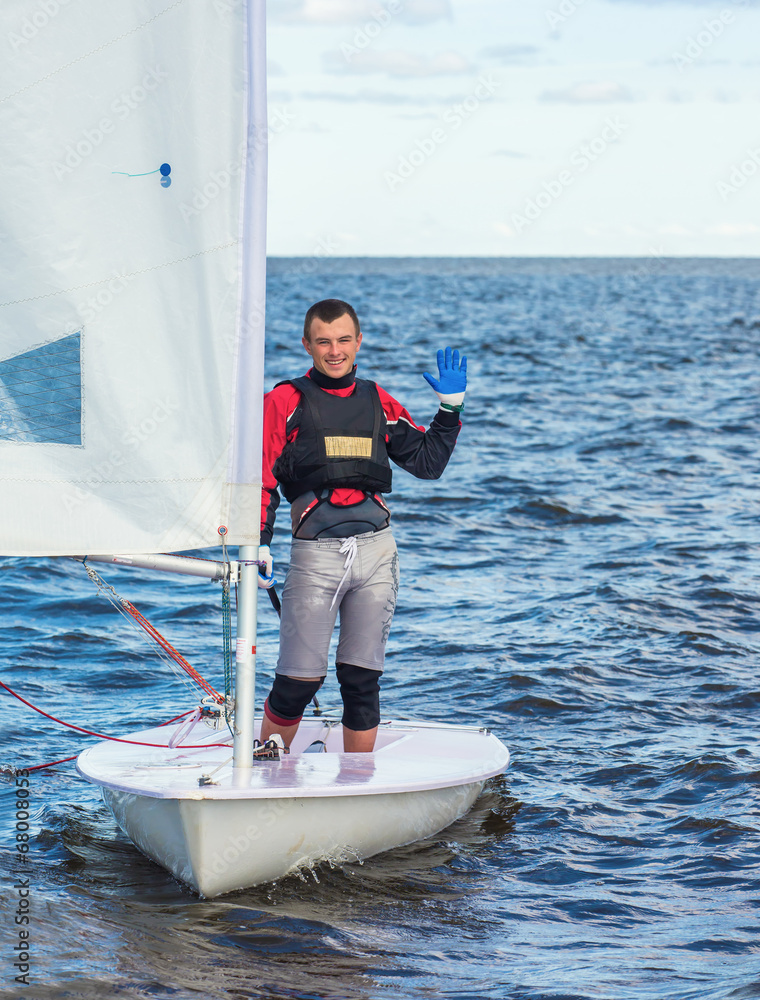 Naklejka premium The guy costs on a sports yacht