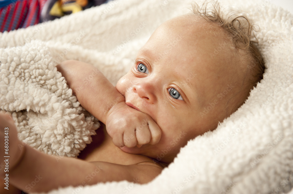 A cute baby isolated on a white background. A cute baby isolated on a white background.