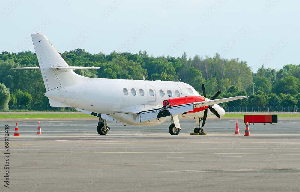 Business jet plane parked on airfield. Business jet plane parked on airfield.