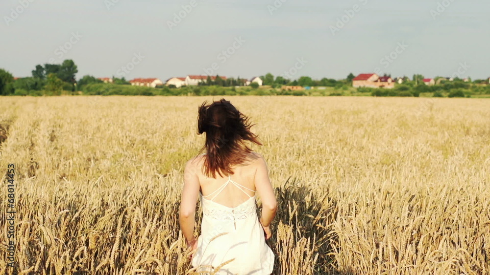 Man and woman running on wheat field, super slow motion Man and woman running on wheat field, super slow motion