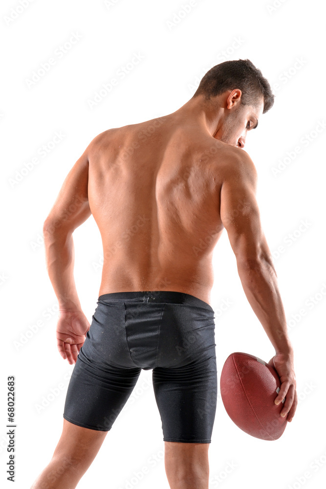 Fototapeta premium Musculoso jugador de rugby sujetando un balon.