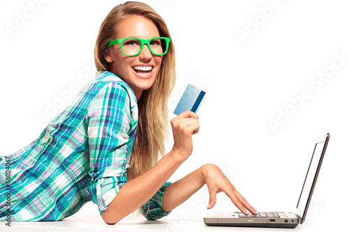 Young Woman Sitting at the desk shopping Online