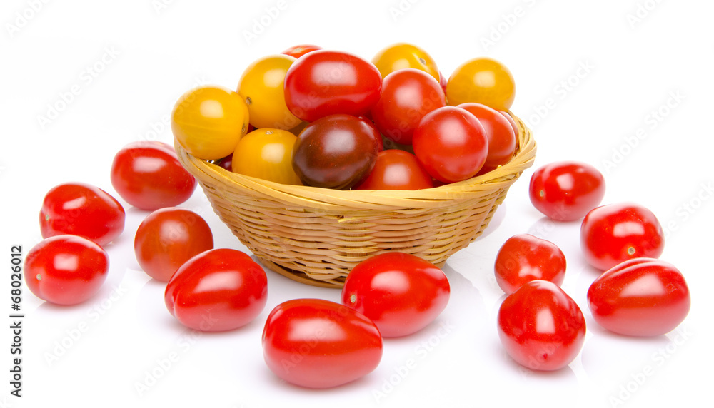 Different varieties of cherry tomatoes in a basket Different varieties of cherry tomatoes in a basket