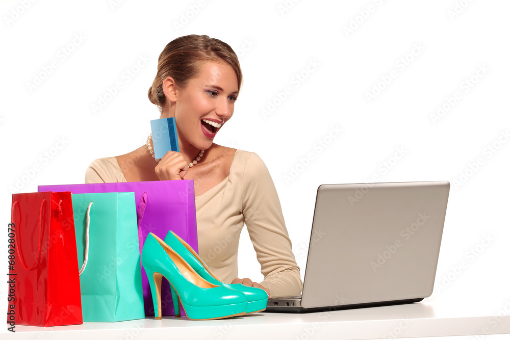 Young Woman Sitting at the desk shopping Online Young Woman Sitting at the desk shopping Online