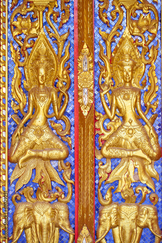 Traditional Thai style carving and painting art at the temple © ittipol