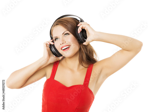 Girl in headphones listening to music. Woman portrait over white
