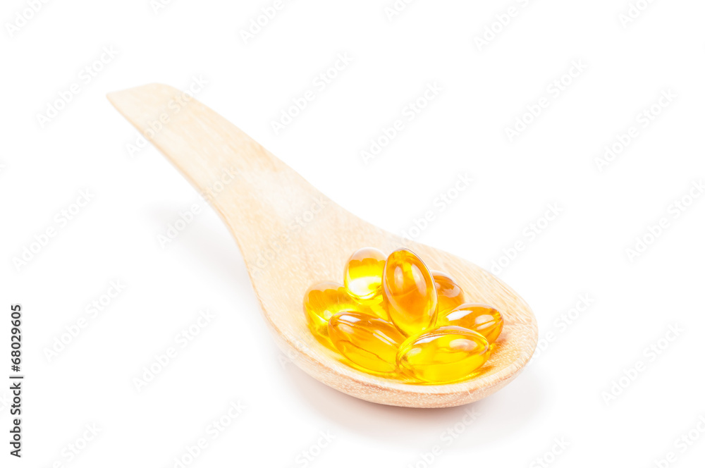 cod liver oil on wooden spoon cod liver oil on wooden spoon