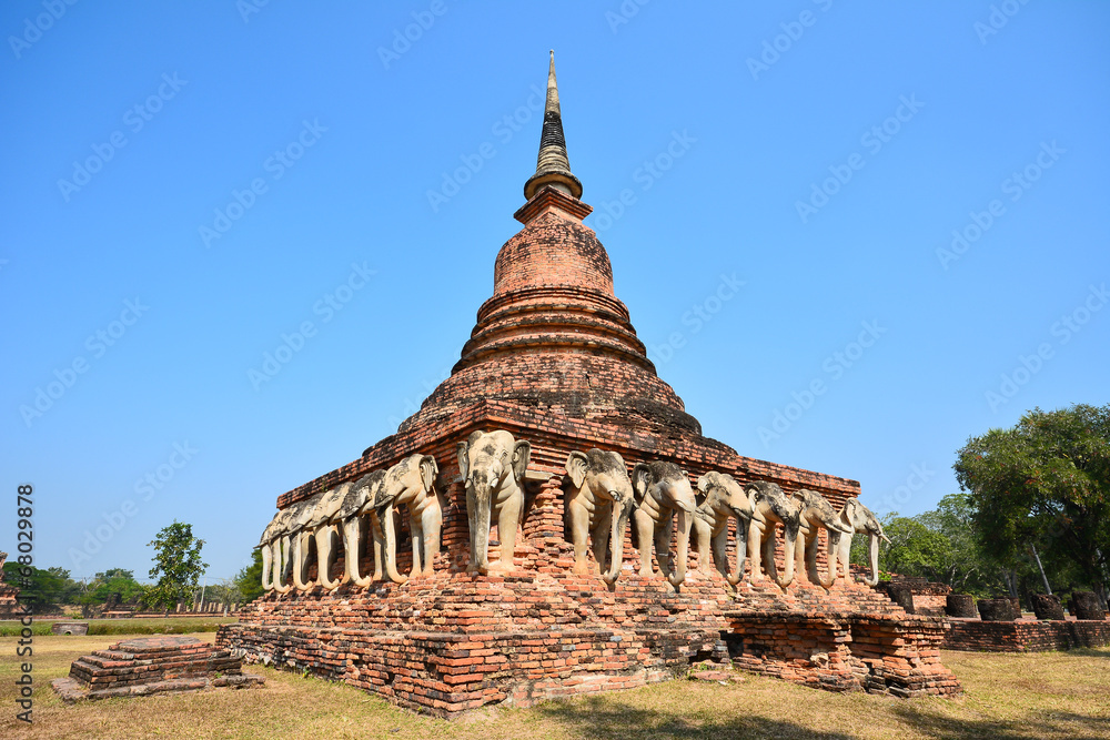 Ancient pagoda with elephant sculptures in Sukhothai Historical