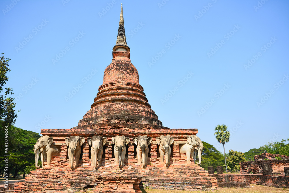 Ancient pagoda with elephant sculptures in Sukhothai Historical