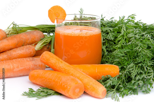 Composition with a glass of carrot juice and fresh carrots
