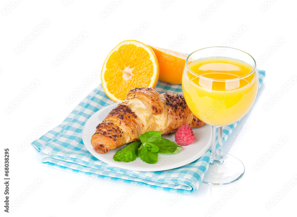 Orange juice and fresh croissant Orange juice and fresh croissant