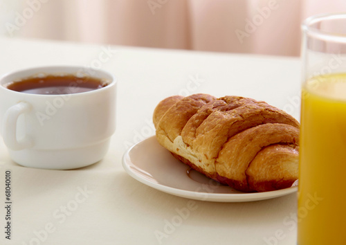 Croissants, Coffee, Orange Juice and Newspapers
