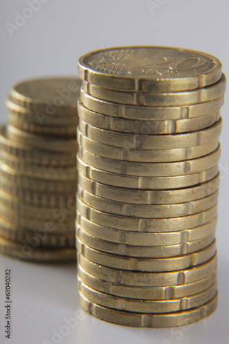 Stack of coins on the desk photo