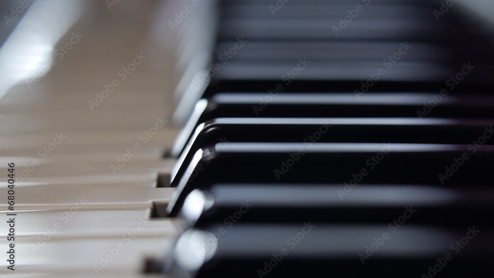 The composer plays the piano. Dolly shot The composer plays the piano. Dolly shot