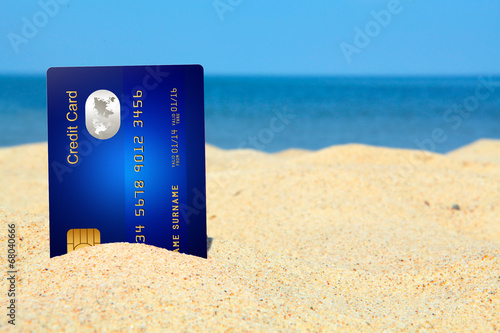 Sticker credit card on the beach