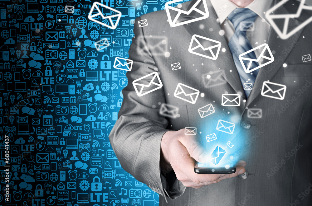 Business man holding smart phone and sending emails Business man holding smart phone and sending emails