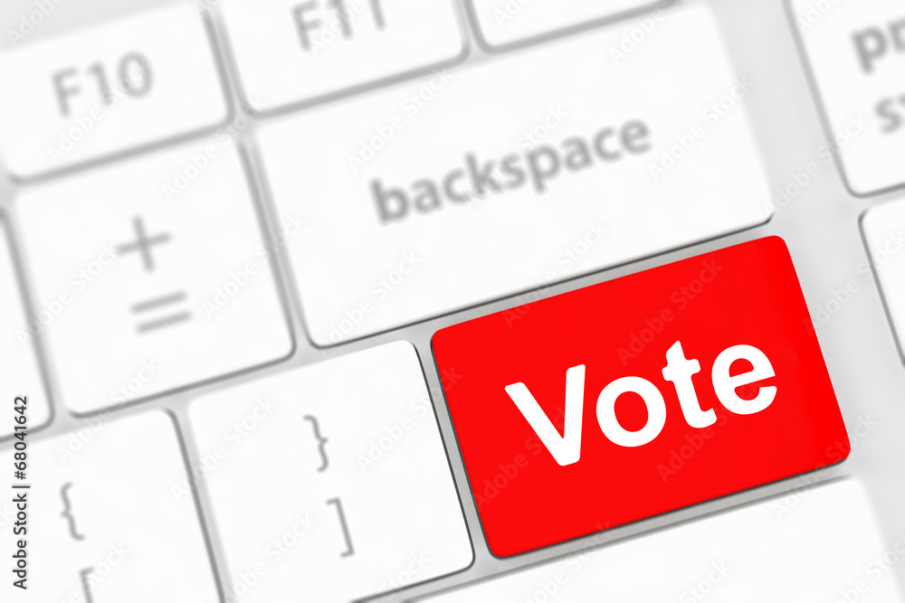 Fototapeta premium vote button on computer keyboard showing internet concept