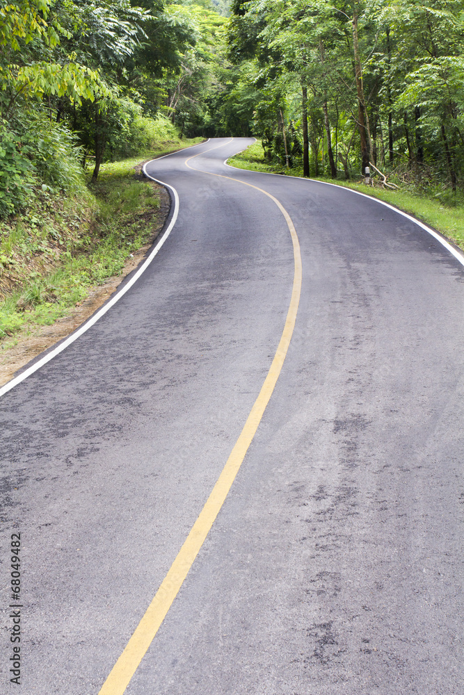 Curve way of asphalt road through the tropical forest in norther