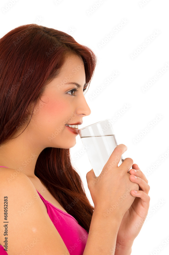 Happy latin young girl drinking water side view Happy latin young girl drinking water side view