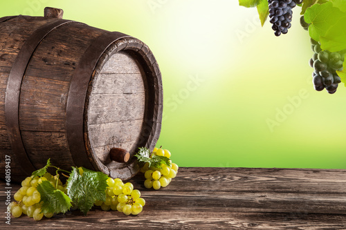 Wine keg on wood with blur green background