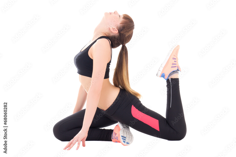 young beautiful woman in sports wear stretching isolated on whit