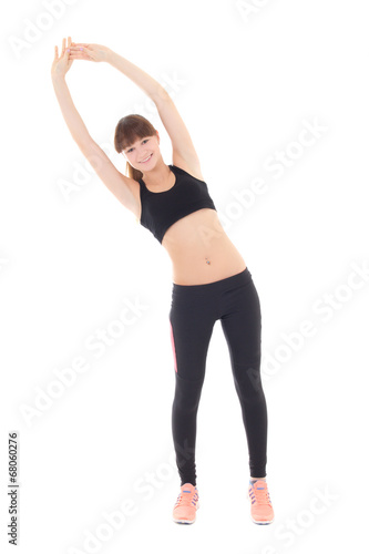 teenage girl in sports wear stretching isolated on white