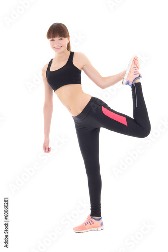 beautiful woman in sports wear stretching leg isolated on white