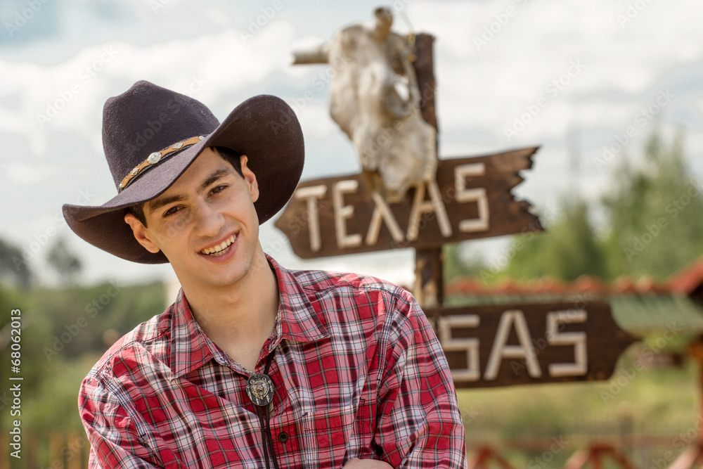 Fototapeta premium Cowboy on sign background.