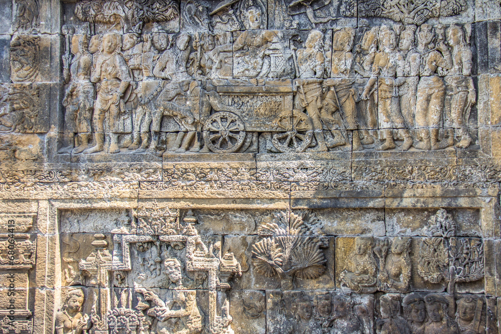 Ancient carvings in the wall of Borobudur Indonesia