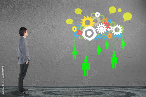 Businessman looking cloud computing network with gea concept