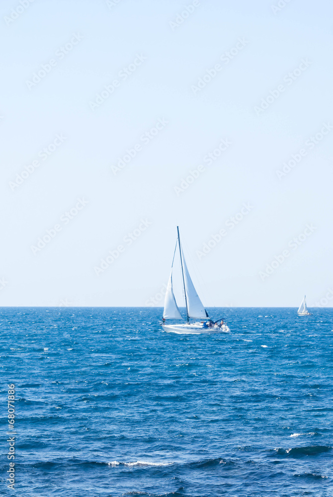 Sailing crew on sailboat