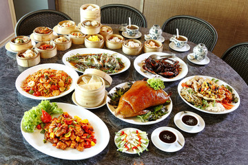 many chinese food on table in lunch time