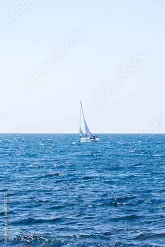 Sailing crew on sailboat