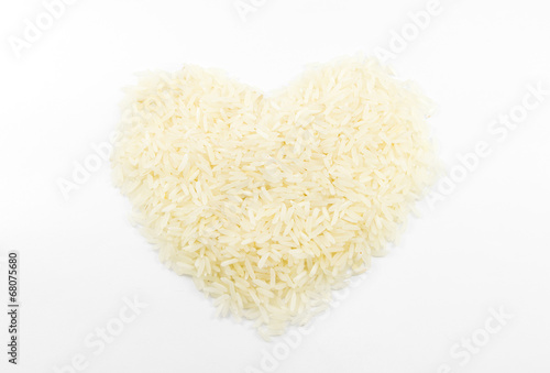 rice heap heart shape on white background