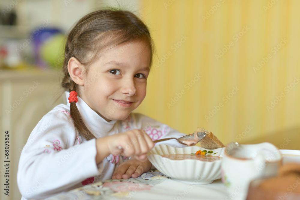 Girl eating soup