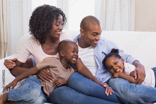 Happy family posing on the couch together